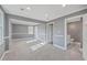 Spacious bedroom with hardwood floors, neutral walls, a connecting door to the bathroom, and plenty of natural light at 1186 French Santee Rd, Jamestown, SC 29453