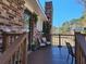 Side deck featuring brown railings, room for seating, and a partial view of the property at 1186 French Santee Rd, Jamestown, SC 29453