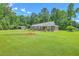 Charming brick home with a well-manicured lawn and mature trees at 1186 French Santee Rd, Jamestown, SC 29453