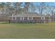 Charming brick ranch-style home with a well-manicured lawn and mature trees, offering classic curb appeal at 1186 French Santee Rd, Jamestown, SC 29453