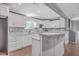 Stylish kitchen featuring white cabinetry, marble countertops, and modern fixtures at 1186 French Santee Rd, Jamestown, SC 29453