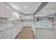 Beautiful white kitchen featuring marble counters, stainless steel sink, and white cabinets at 1186 French Santee Rd, Jamestown, SC 29453
