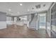 Spacious living room with hardwood floors, stairs, and an open concept kitchen at 1186 French Santee Rd, Jamestown, SC 29453