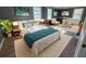 Inviting bedroom featuring large windows, hardwood floors, a comfortable bed, and a seating area for relaxation at 1186 French Santee Rd, Jamestown, SC 29453