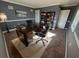 Office with brown carpet, gray walls, and large desk with black leather chair at 1186 French Santee Rd, Jamestown, SC 29453