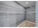 Practical walk-in closet with built-in wire shelving units for storage solutions, neutral walls, and neutral carpet at 1186 French Santee Rd, Jamestown, SC 29453
