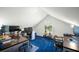 Finished attic space with blue carpet and office furniture; bright natural light at 121 Arrowridge Ct, Summerville, SC 29485
