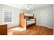 Cozy bedroom with a bunk bed, a window, and hardwood floors at 121 Arrowridge Ct, Summerville, SC 29485