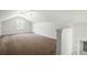 Spacious bonus room with plush carpet and a large window at 121 Arrowridge Ct, Summerville, SC 29485
