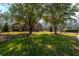 Charming brick home with a well-manicured lawn and mature trees at 121 Arrowridge Ct, Summerville, SC 29485