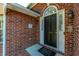 Close-up of the front door featuring black paint and glass window at 121 Arrowridge Ct, Summerville, SC 29485