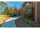Charming front exterior showcasing meticulous landscaping and a gracefully curved walkway leading to the inviting entrance at 121 Arrowridge Ct, Summerville, SC 29485