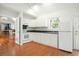 Well-lit kitchen with white cabinets, ample counter space, and modern appliances at 121 Arrowridge Ct, Summerville, SC 29485