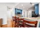 Spacious kitchen showcasing a breakfast bar with barstools, granite countertops, and ample cabinet space for cooking at 121 Arrowridge Ct, Summerville, SC 29485