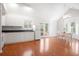 Open kitchen flows into the dining area with white cabinetry and views of the backyard at 121 Arrowridge Ct, Summerville, SC 29485