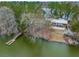 An aerial view of the park building, docks, fire pit and seating area near the lake at 1368 Clay Field Trl, Summerville, SC 29485