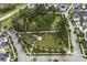 Aerial view of a neighborhood park with walking paths, green spaces, and play areas, ideal for outdoor enjoyment at 1368 Clay Field Trl, Summerville, SC 29485