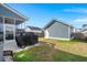 Well-maintained backyard featuring a screened-in porch and detached garage, great for outdoor living and storage at 1368 Clay Field Trl, Summerville, SC 29485