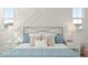 Close-up of a bedroom with a stylish bed and modern bedside tables at 1368 Clay Field Trl, Summerville, SC 29485