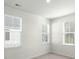 Bright bedroom with neutral carpet and three large windows with blinds for ample natural light at 1368 Clay Field Trl, Summerville, SC 29485