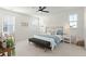 Bright bedroom with a decorative accent wall, large windows, and a comfortable bed at 1368 Clay Field Trl, Summerville, SC 29485