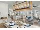 Bright open concept with kitchen, living room, and dining area featuring a large unique light fixture at 1368 Clay Field Trl, Summerville, SC 29485