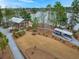 Exterior view of a park building, boat storage, path ways and views of the lake in the background at 1368 Clay Field Trl, Summerville, SC 29485