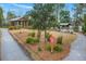 This exterior view showcases the park building, boat storage, path ways and views of the lake in the background at 1368 Clay Field Trl, Summerville, SC 29485