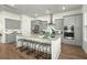 Modern kitchen with gray cabinets, stainless steel appliances, and center island with seating at 1368 Clay Field Trl, Summerville, SC 29485