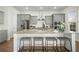 Modern kitchen featuring gray cabinets, stainless appliances, and center island with bar stool seating at 1368 Clay Field Trl, Summerville, SC 29485