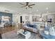 Open-concept living space with kitchen, dining area, and living room featuring stylish decor at 1368 Clay Field Trl, Summerville, SC 29485