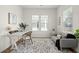 Bright office space with natural light, a modern desk, comfortable seating, and neutral decor at 1368 Clay Field Trl, Summerville, SC 29485