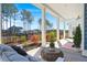 Inviting porch with comfortable seating, a stylish coffee table, and views of the landscaped front yard at 1368 Clay Field Trl, Summerville, SC 29485