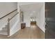 Inviting entryway featuring hardwood floors, stairs with white banisters, and modern decor at 141 Woodland Oak Way, Summerville, SC 29485