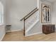 Bright entryway featuring hardwood floors, stairs with white banisters, and modern decor at 141 Woodland Oak Way, Summerville, SC 29485