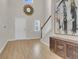 Bright entryway featuring hardwood floors, stairs with white banisters, and elegant decor at 141 Woodland Oak Way, Summerville, SC 29485