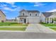 Charming two-story home with a well-manicured lawn and attached two car garage at 141 Woodland Oak Way, Summerville, SC 29485