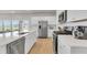 Modern kitchen with white cabinets, stainless steel appliances, and a breakfast bar, providing functionality and style at 141 Woodland Oak Way, Summerville, SC 29485
