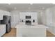 Bright kitchen featuring stainless steel appliances, white cabinetry, and a spacious island with bar seating for casual dining at 141 Woodland Oak Way, Summerville, SC 29485