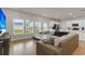 Cozy living room with a comfortable sectional sofa, large windows, and an open layout at 141 Woodland Oak Way, Summerville, SC 29485