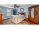 Comfortable bedroom with a ceiling fan, cozy bedding, and ample natural light at 159 Bridgecreek Dr, Goose Creek, SC 29445