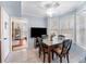 Bright dining area bathed in natural light with a table set for four and easy access to the kitchen at 159 Bridgecreek Dr, Goose Creek, SC 29445