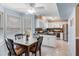 Bright dining area with views to the kitchen and eat in bar, with big windows and lots of light at 159 Bridgecreek Dr, Goose Creek, SC 29445
