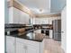 Modern kitchen with white cabinets, granite countertops, and stainless steel appliances offers great features at 159 Bridgecreek Dr, Goose Creek, SC 29445