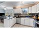 Modern kitchen with granite countertops and stainless steel appliances complemented by a cozy dining area at 159 Bridgecreek Dr, Goose Creek, SC 29445