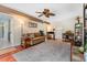 Inviting living room boasts wood floors, ceiling fan, and an open doorway leading into the adjacent rooms at 159 Bridgecreek Dr, Goose Creek, SC 29445