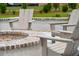 Outdoor fire pit with comfortable Adirondack chairs, perfect for entertaining in a serene setting at 1680 Siloh Dr # 469, Mount Pleasant, SC 29466