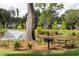 Scenic pond view with a fountain, picnic table, and barbecue grill, perfect for relaxing and enjoying the outdoors at 1680 Siloh Dr # 469, Mount Pleasant, SC 29466