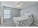 Comfortable bedroom with soft gray walls, a ceiling fan, carpeted floors, and a calming aesthetic at 1717 Brittlebush Ln, Johns Island, SC 29455