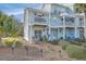 Charming coastal townhome featuring a private balcony and well-maintained landscaping at 1717 Brittlebush Ln, Johns Island, SC 29455